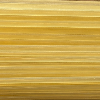 Close-up of handcrafted natural gut strings showing their warm golden colour and natural texture.